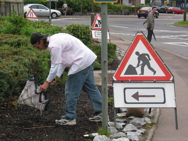 Warning-ManOpeningUmbrella.jpg
